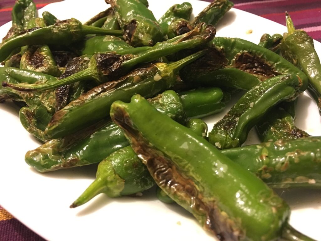 pimientos de padron 1 Pimientos de Padrón is spicy, vegetarian , and one of the most popular Tapas Bar foods in Spain